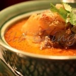 a classic thai style slow cooked curry with chancy beef, potatoes, peanuts, caramelised onions & herbs