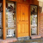 Exterior view of colored leadlight abstarcted from Rainbow Lorikeets