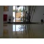 This floor was resurfaced to remove all lippage.  Grout joints were filled flush with the tiles and this is the result.