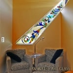 Multicolored glass, laminated to etched glass background with clear border.