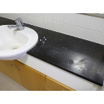Vanity before Polishing.  Heavily etched by incorrect cleaner and general use this marble benchtop needs polishing.