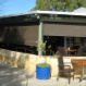 Ziptrak blinds at cafe, view from outside in.