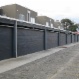 We are able to install panel lift garage doors and make a boring laneway and make it  look interesting and add value too