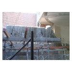 Lifting concrete block using a crane after cutting into manageble sizes