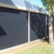 Outdoor zip track blinds with pelmet.